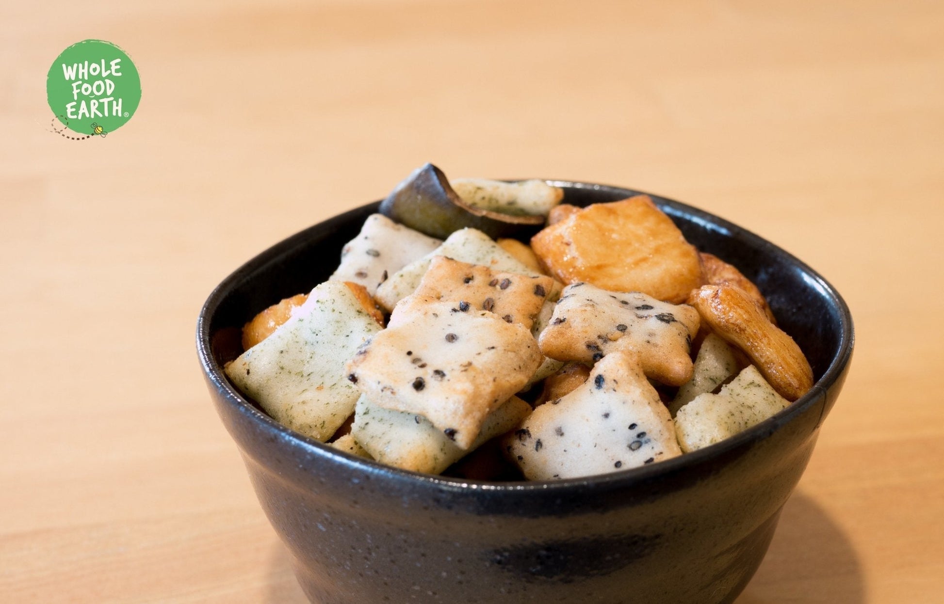 Whole Food Earth rice cracker mix featuring assorted GMO-free, vegan, and dairy-free rice and peanut crackers.