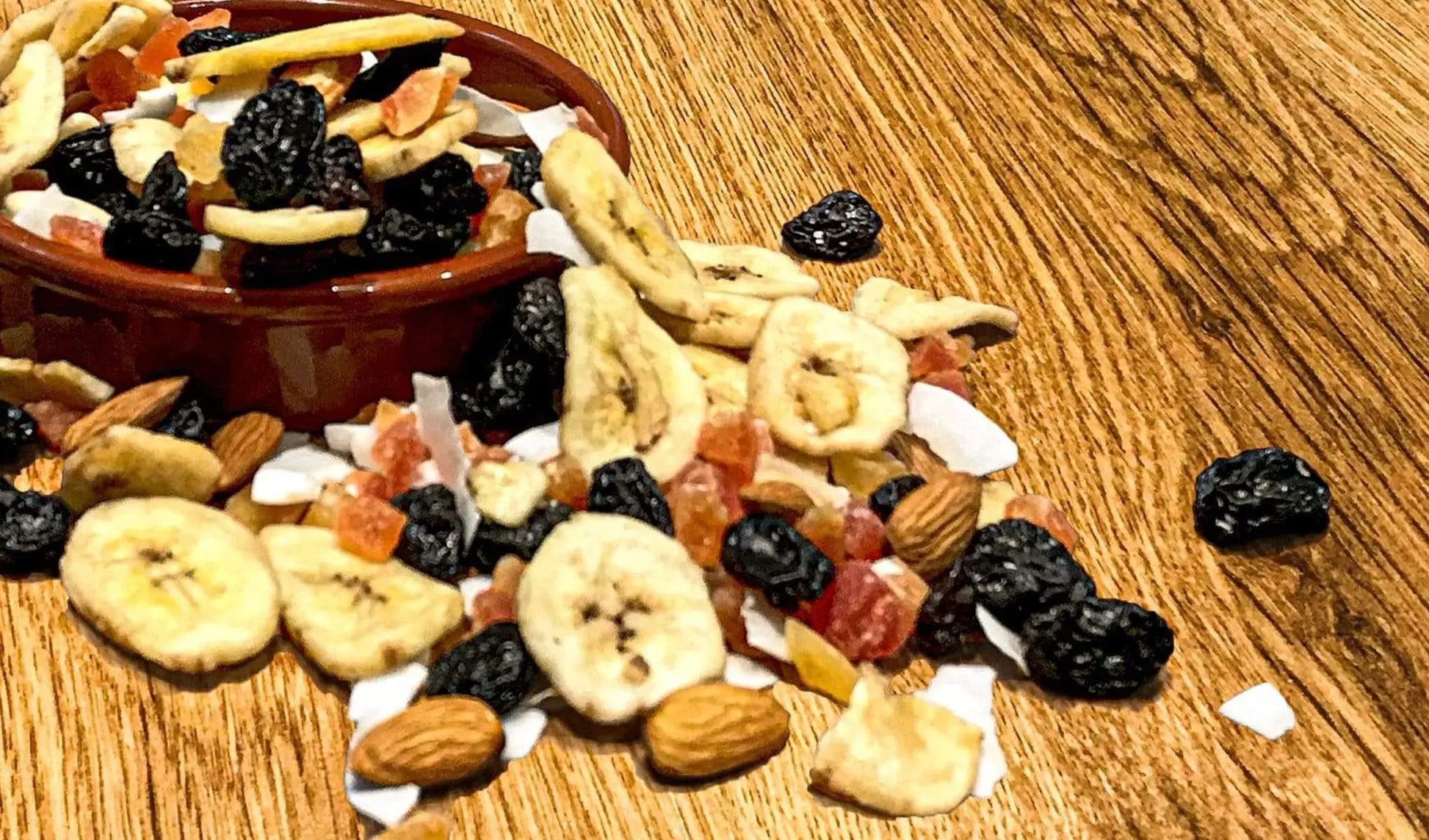 Whole Food Earth Super Tropical Mix cereal in a bowl, showcasing colorful tropical grains and dried fruits, GMO-free and vegan.