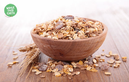 Whole Food Earth toasted malted wheat flakes cereal in a bowl, showing golden, toasted wheat flakes with no added sugar or GMOs.