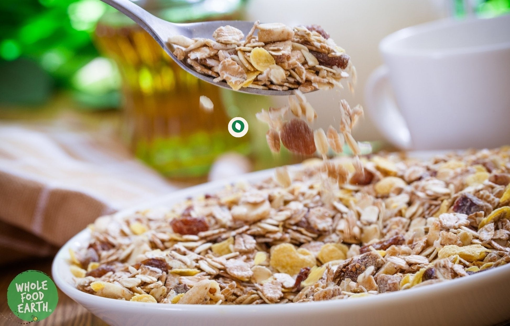 Whole Food Earth Tropical Muesli cereal with flakes, dried fruit, and nuts, GMO-free and vegan-friendly.
