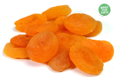 Dried medium apricots from Whole Food Earth, GMO-free, vegan, dairy-free, with no added sugar, shown in a close-up image.