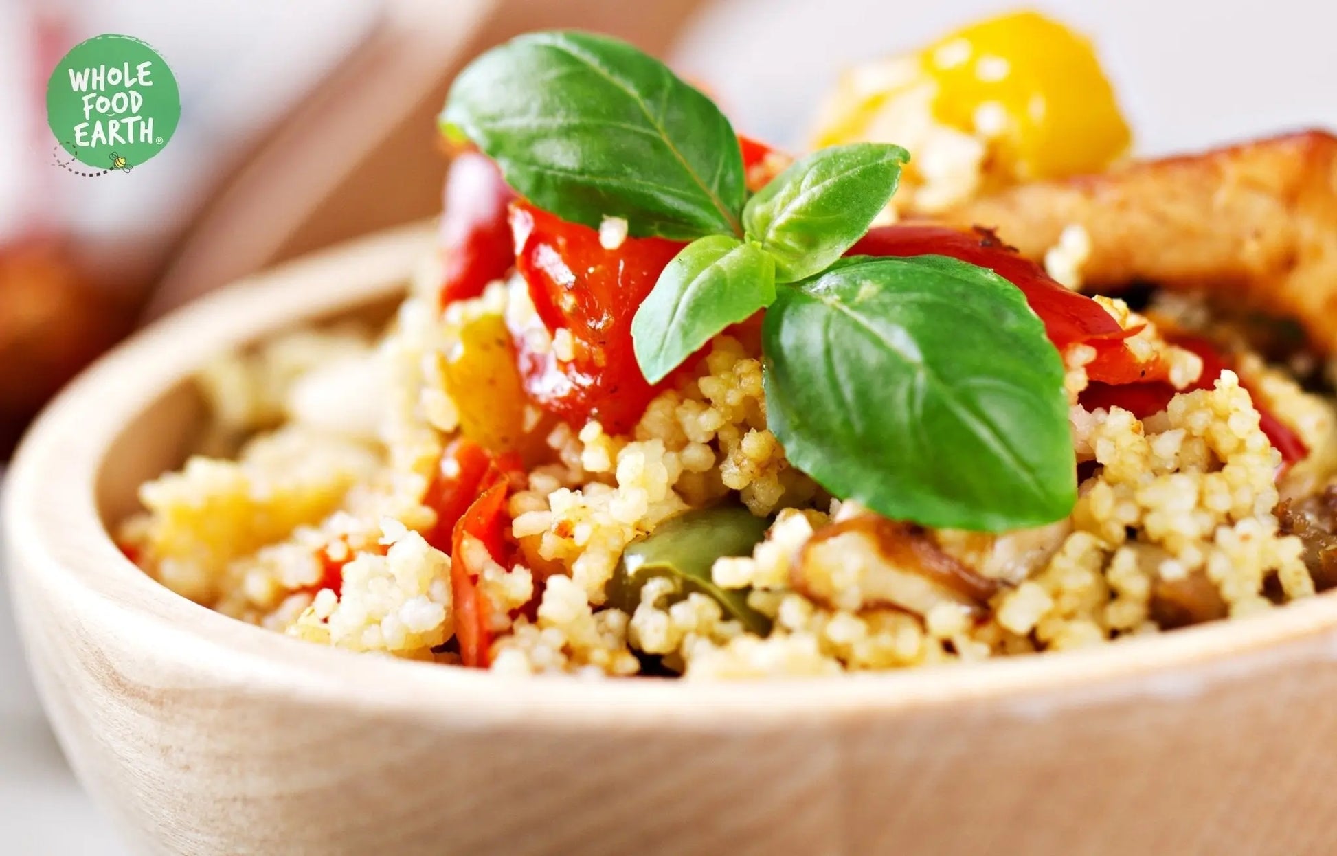 Whole Food Earth wholemeal couscous in a bowl, showing the gluten-free, vegan, GMO-free rice and couscous product.