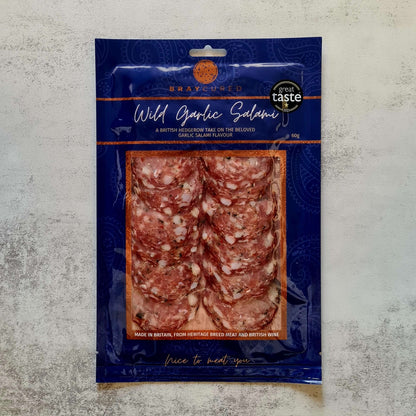 Bray Cured Bacchus Brut and British charcuterie hamper with wild garlic salami pack showing slices and packaging.