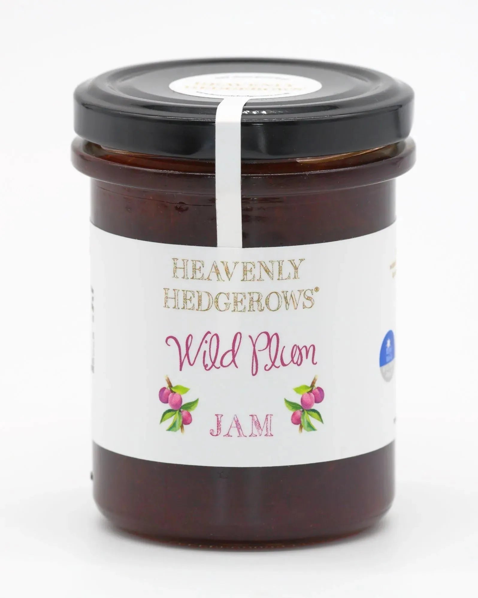 Heavenly Hedgerows Wild Plum Jam jar with a scoop of jam and fresh wild plums on a rustic wooden surface.