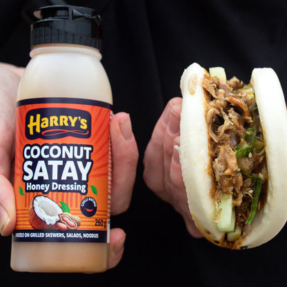 Harry's Hot Honey Coconut Satay Honey Dressing in a glass jar, showcasing a creamy coconut and honey mixture for salads and dishes.