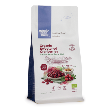 Whole Food Earth dried cranberries, sliced and whole, showing vibrant red color and textured surface of these natural dried fruits.