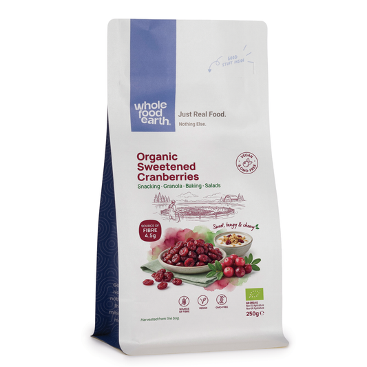 Sliced and whole cranberries from ArtisanBox, fresh red cranberries with detailed texture and vibrant color.