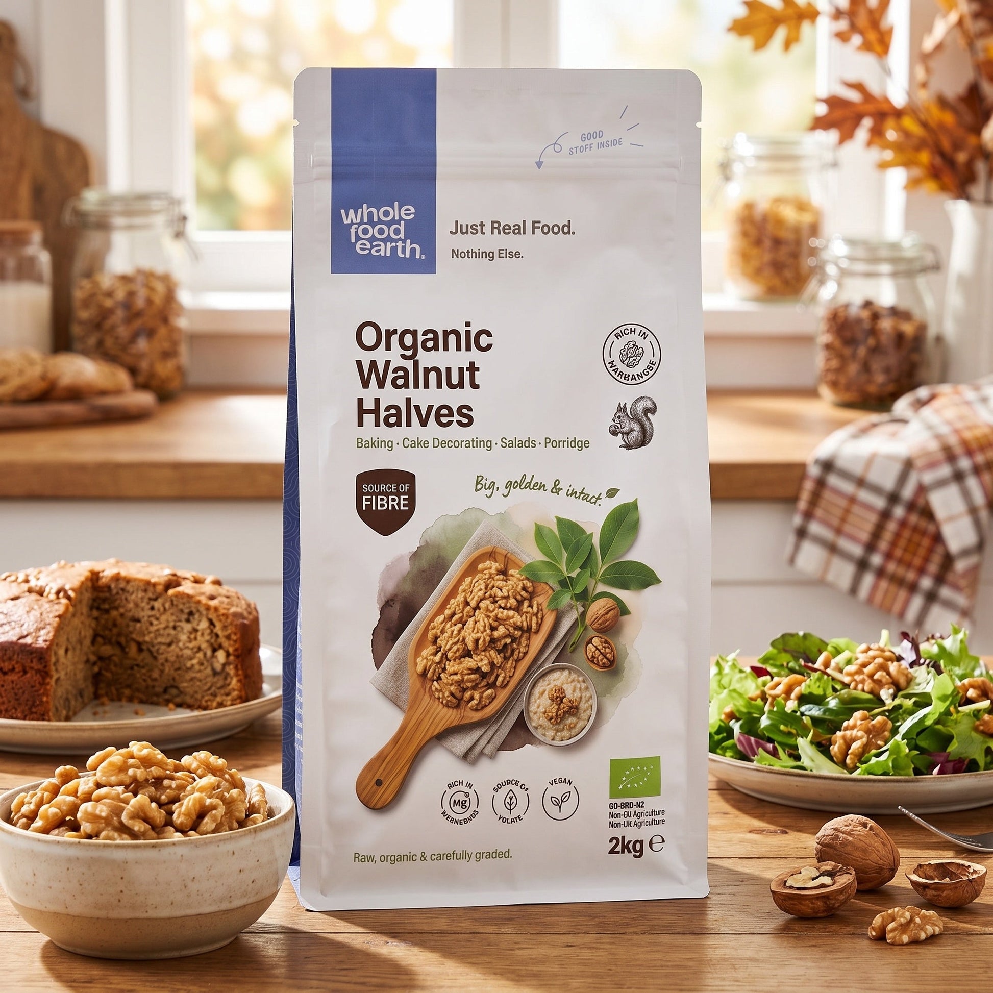 Organic Walnut Halves from Whole Food Earth shown in a bowl with some scattered walnuts, highlighting fresh, natural nuts and seeds.