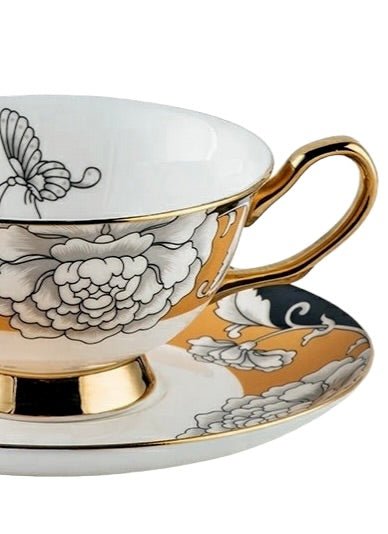 KitchBoom Regal Bloom bone china teacup with yellow sapphire design and matching saucer, elegant and delicate tea set.