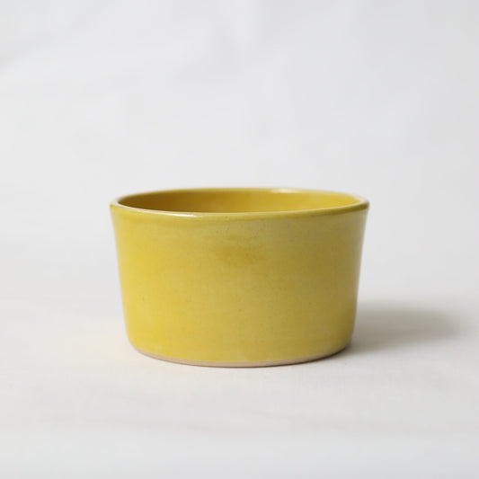 Sun yellow classic side bowl by Katie L Thompson Designs, featuring a vibrant yellow ceramic bowl with a simple, elegant design.