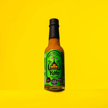 Bottle of YoYo Laos Sauce Original Ginger Chilli Sauce, signature sauce with ginger and chilli visible in the clear glass bottle.